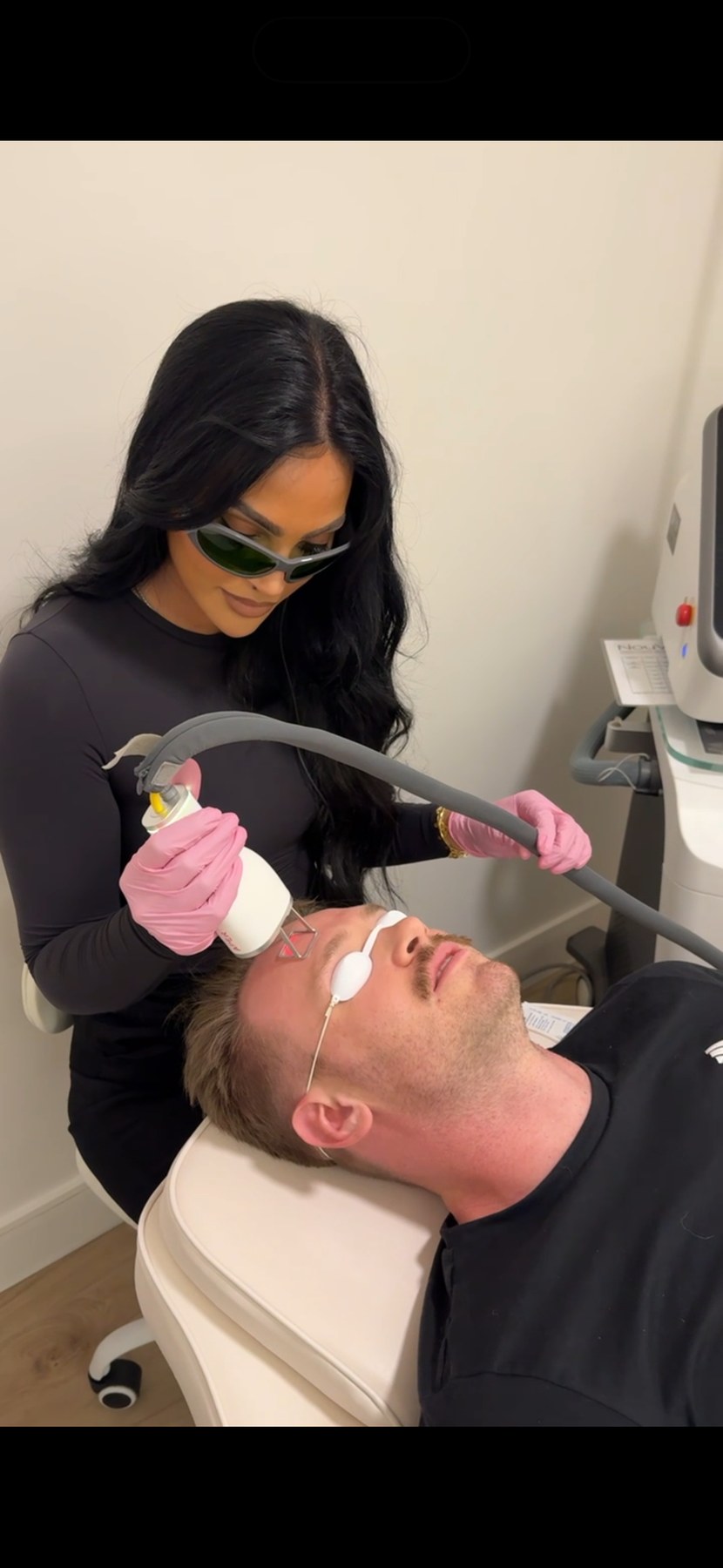 LYEV provider performing a laser facial treatment